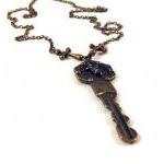 Bronzed angels key necklace..