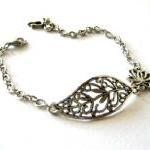 Antiqued silver filigree le..