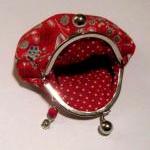 Flower on red frame pouch -..