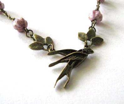 Swallow necklace jewelry with leaves and light purple Czech melon glass beads