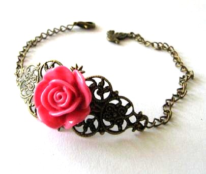 Fuchsia pink resin flower bracelet jewelry with bronzed filigree and bird charm