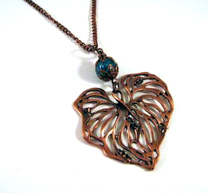 Simple copper leaf necklace jewelry with teal colored glass bead