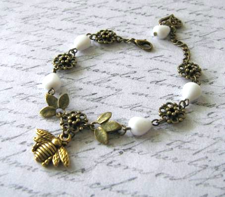 Antiqued gold bee bracelet Czech white beads jewelry leaves and heart charms