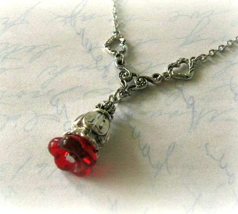 Red flower bud necklace jewelry with antiqued silver heart charms